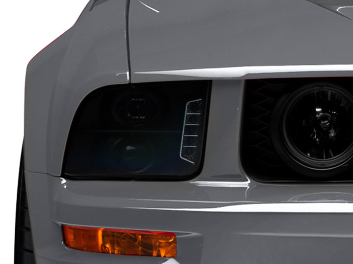 Raxiom 05-09 Ford Mustang w/ Halogen LED Halo Prjctr Headlights-Blk Hsng(Smoked Lens Exclude GT500) - Bull Strap