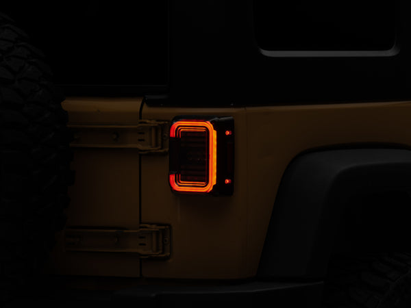Raxiom 07-18 Jeep Wrangler JK Axial Series LED Halo Tail Lights- Black Housing (Dark Smoked Lens) - Bull Strap
