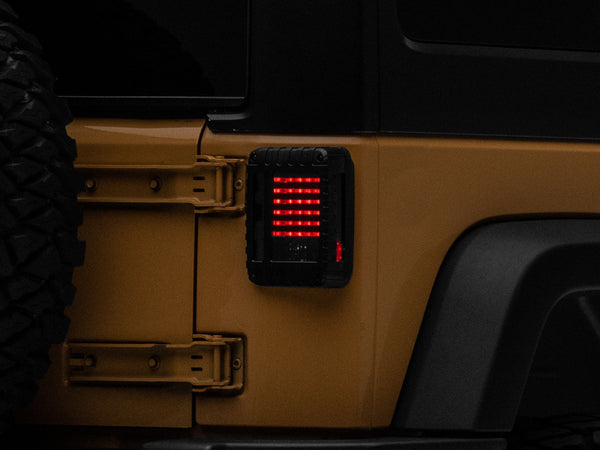 Raxiom 07-18 Jeep Wrangler JK LED Tail Lights- Black Housing (Smoked Lens) - Bull Strap