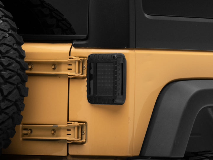 Raxiom 07-18 Jeep Wrangler JK LED Tail Lights- Black Housing (Smoked Lens) - Bull Strap
