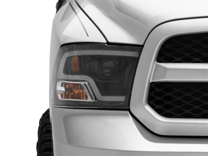 Raxiom 09-18 RAM 1500 LED Halo Projector Headlights- Black Housing (Clear Lens) - Bull Strap