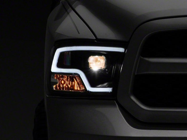 Raxiom 09-18 RAM 1500 LED Halo Projector Headlights- Black Housing (Clear Lens) - Bull Strap