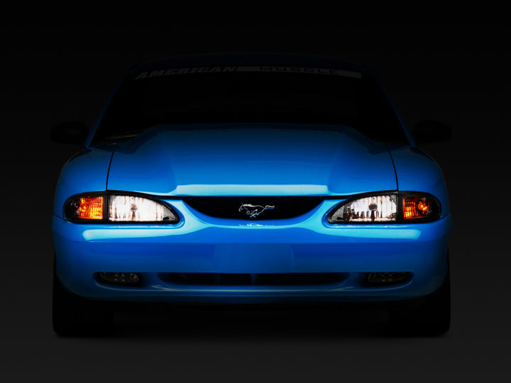 Raxiom 94-98 Mustang Axial Series Cobra Style Headlights- Black Housing (Clear Lens) - Bull Strap