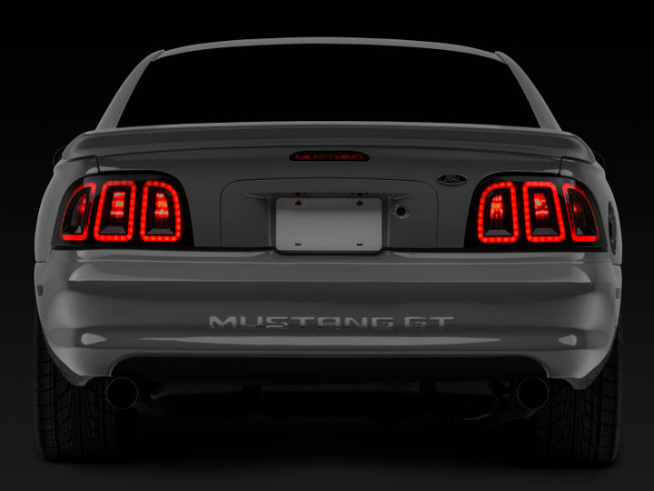 Raxiom 96-98 Ford Mustang Icon LED Tail Lights- Black Housing (Smoked Lens) - Bull Strap