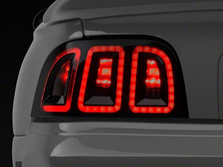 Raxiom 96-98 Ford Mustang Icon LED Tail Lights- Black Housing (Smoked Lens) - Bull Strap