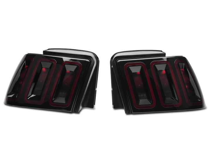 Raxiom 99-04 Ford Mustang Excluding 99-01 Cobra Icon LED Tail Lights- Black Housing (Smoked Lens) - Bull Strap