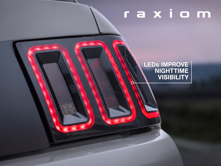Raxiom 99-04 Ford Mustang Excluding 99-01 Cobra Icon LED Tail Lights- Black Housing (Smoked Lens) - Bull Strap