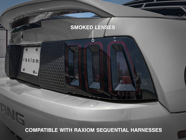 Raxiom 99-04 Ford Mustang Excluding 99-01 Cobra Icon LED Tail Lights- Black Housing (Smoked Lens) - Bull Strap