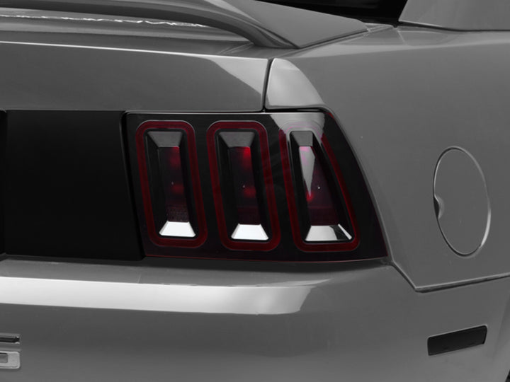 Raxiom 99-04 Ford Mustang Excluding 99-01 Cobra Icon LED Tail Lights- Black Housing (Smoked Lens) - Bull Strap