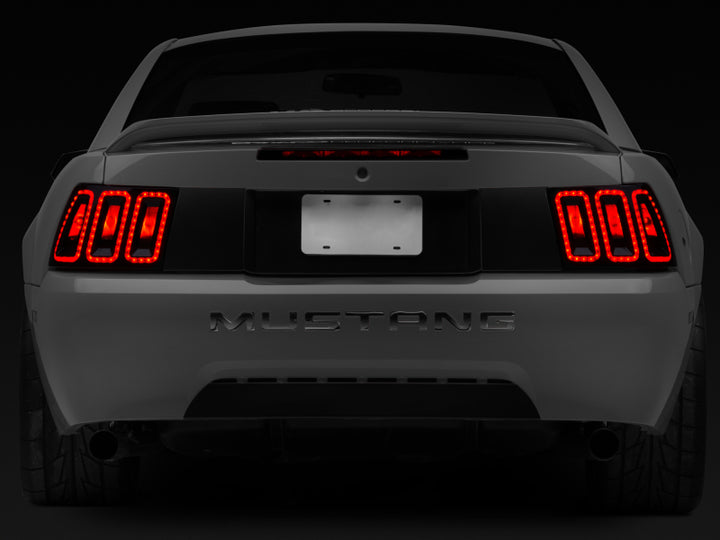 Raxiom 99-04 Ford Mustang Excluding 99-01 Cobra Icon LED Tail Lights- Black Housing (Smoked Lens) - Bull Strap