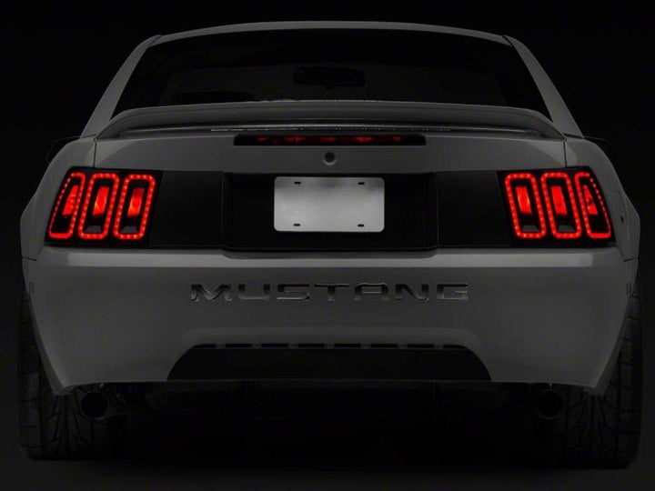Raxiom 99-04 Ford Mustang Excluding 99-01 Cobra Icon LED Tail Lights- Black Housing (Smoked Lens) - Bull Strap