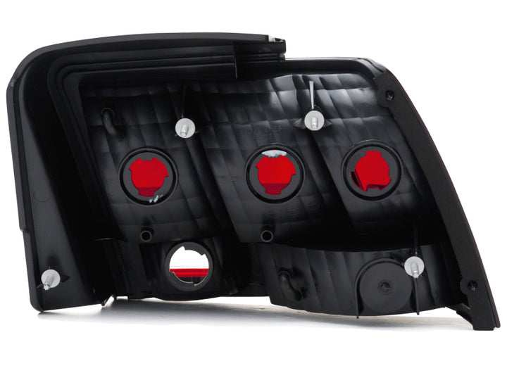 Raxiom 99-04 Ford Mustang Excluding 99-01 Cobra Tail Lights- Black Housing (Smoked Lens) - Bull Strap
