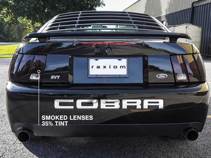 Raxiom 99-04 Ford Mustang Excluding 99-01 Cobra Tail Lights- Black Housing (Smoked Lens) - Bull Strap