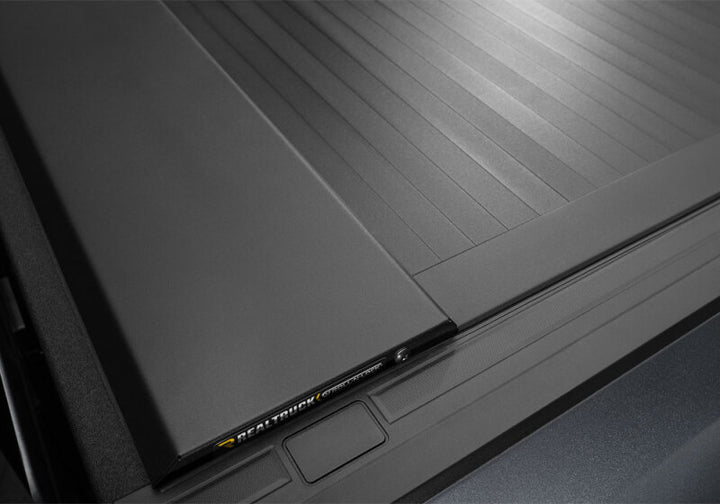 Roll-N-Lock 2019 Chevy Silverado 1500 68-3/8in E-Series Retractable Tonneau Cover - Bull Strap