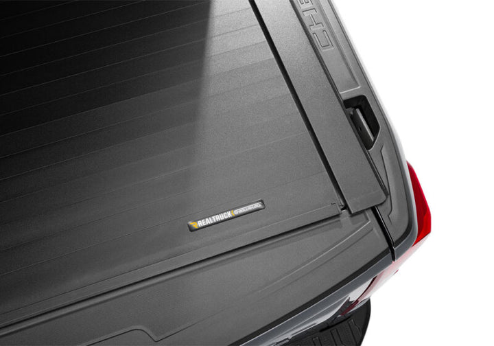Roll-N-Lock 2019 Chevy Silverado 1500 68-3/8in E-Series Retractable Tonneau Cover - Bull Strap