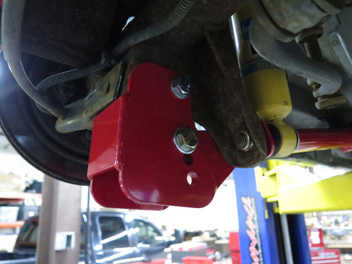 UMI Performance 82-02 GM F-Body Lower Control Arm Relocation Brackets - Bolt-In - Bull Strap