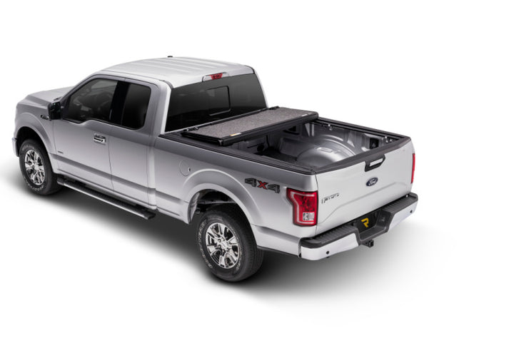 UnderCover 15-20 Ford F-150 5.5ft Ultra Flex Bed Cover - Matte Black Finish - Bull Strap