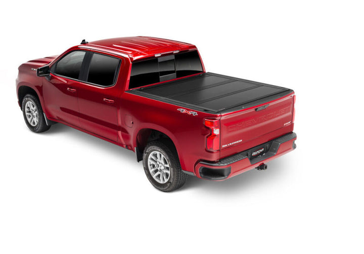 UnderCover 19-20 Chevy Silverado 1500 5.8ft Ultra Flex Bed Cover - Matte Black Finish - Bull Strap