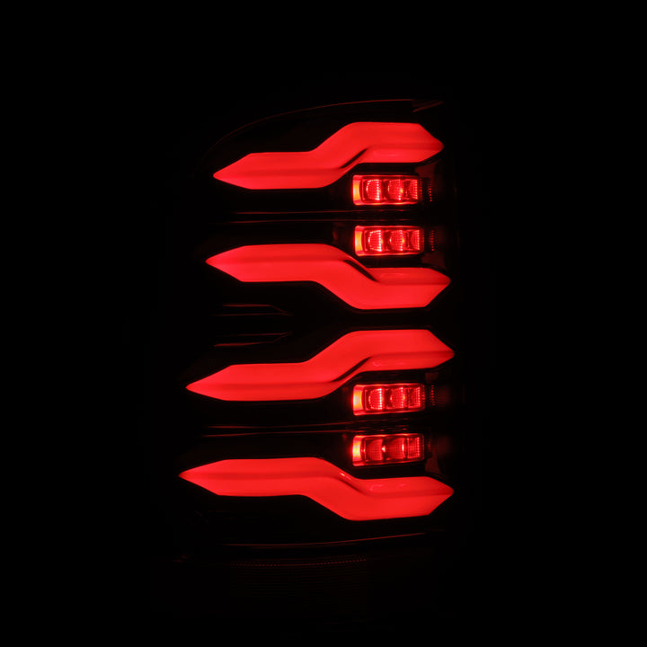 AlphaRex 09-18 Dodge Ram Luxx-Series LED Tail Lights Alpha-Black w/ Activation Light & Seq. Signal - Bull Strap