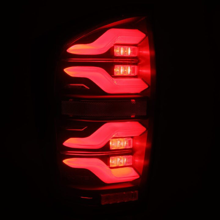 AlphaRex 16-21 Toyota Tacoma LUXX LED Taillights Blk w/Activ Light/Seq Signal - Bull Strap