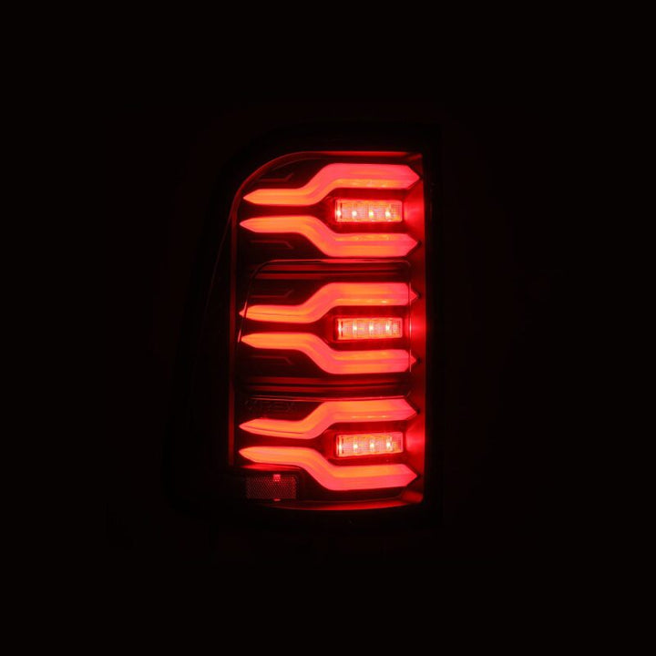 AlphaRex 19-21 Dodge Ram 1500 Luxx-Series LED Tail Lights Black w/Activ Light/Seq Signal - Bull Strap
