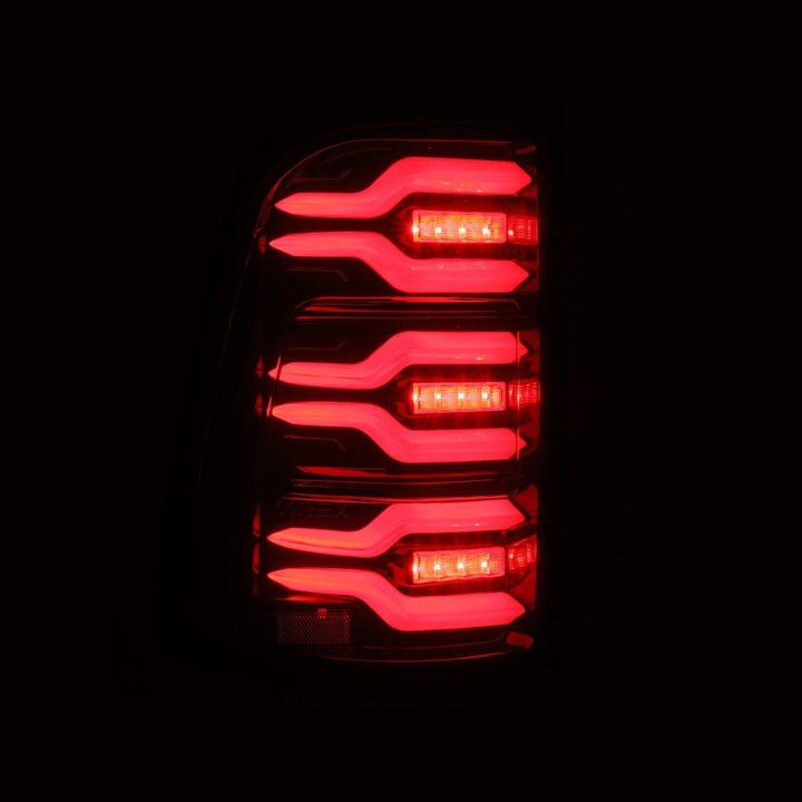 AlphaRex 19-21 Dodge Ram 1500 Luxx-Series LED Tail Lights Black/Red w/Activ Light/Seq Signal - Bull Strap