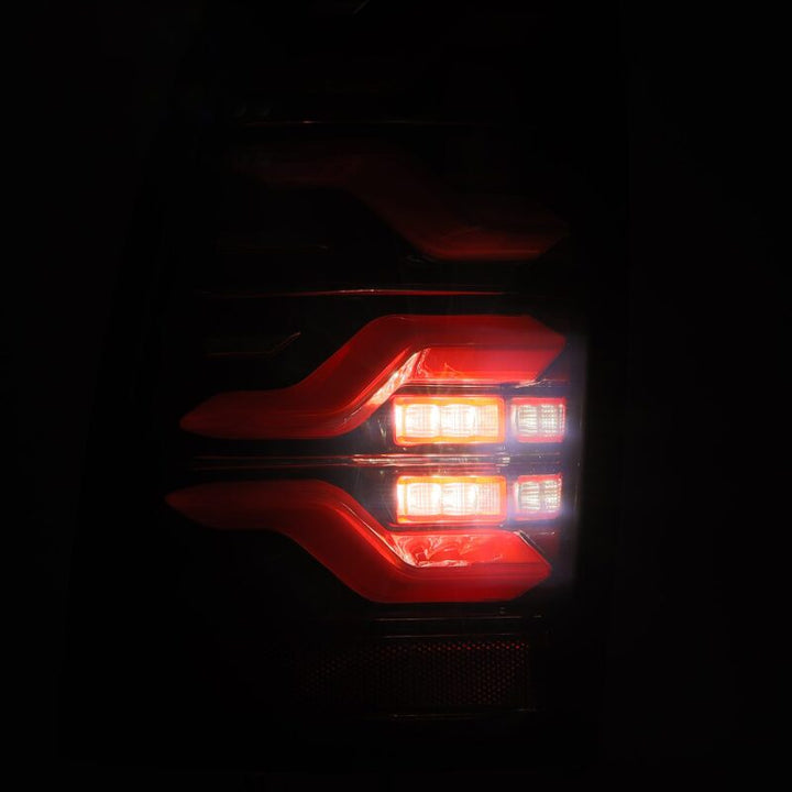AlphaRex 05-15 Toyota Tacoma LUXX LED Taillights Blk/Red w/Activ Light/Seq Signal - Bull Strap