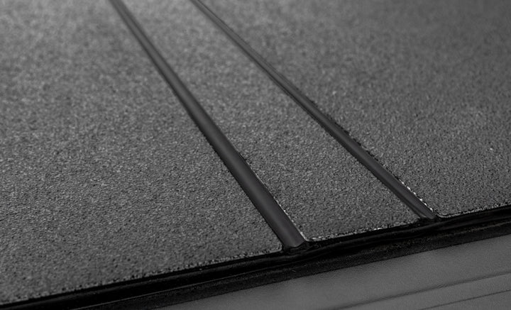 Access LOMAX Tri-Fold Cover Black Urethane Finish 04+ Ford F-150 - 5ft 6in Bed - Bull Strap