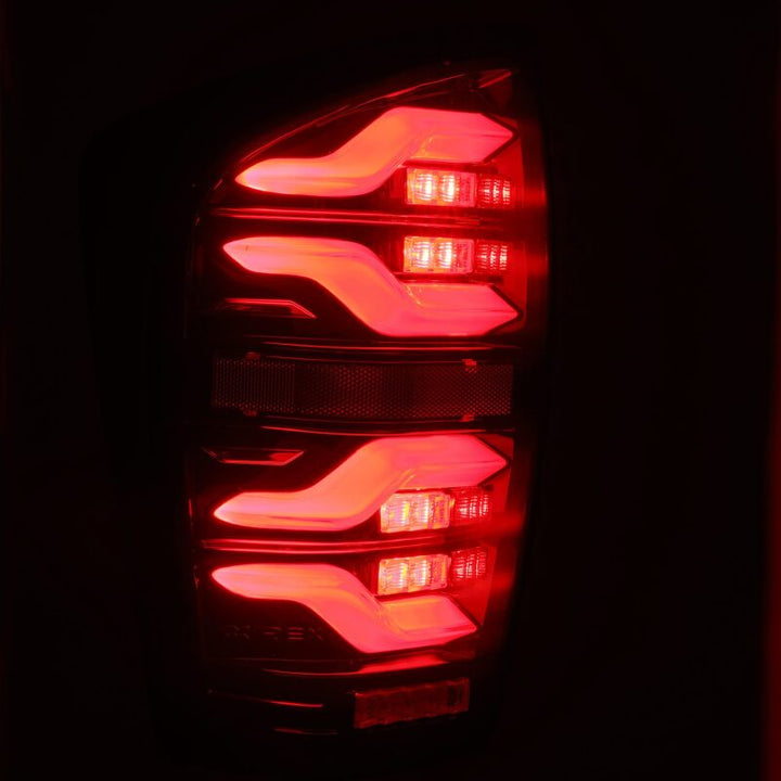 AlphaRex 16-21 Toyota Tacoma LUXX LED Taillights Blk/Red w/Activ Light/Seq Signal - Bull Strap