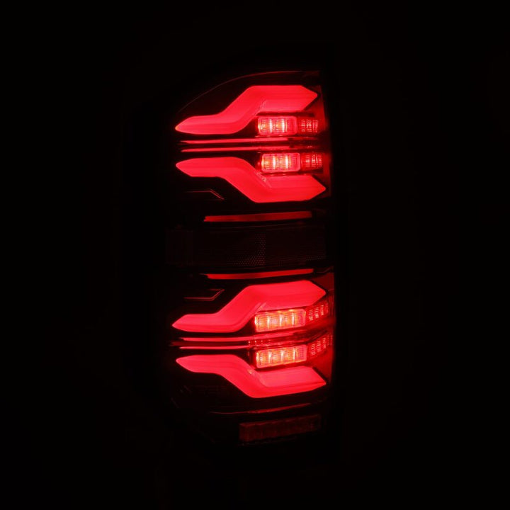 AlphaRex 14-21 Toyota Tundra LUXX LED Taillights Black/Red w/Activ Light/Seq Signal - Bull Strap