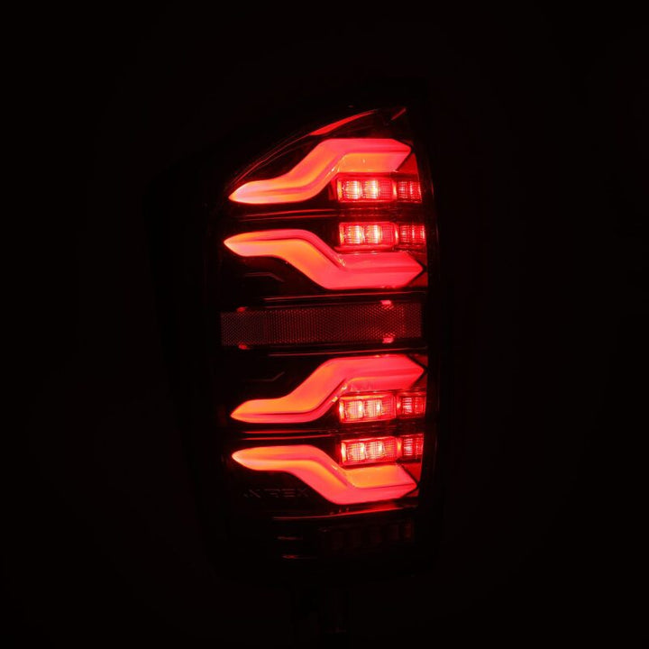 AlphaRex 16-21 Toyota Tacoma LUXX LED Taillights Alpha Blk w/Activ Light/Seq Signal - Bull Strap