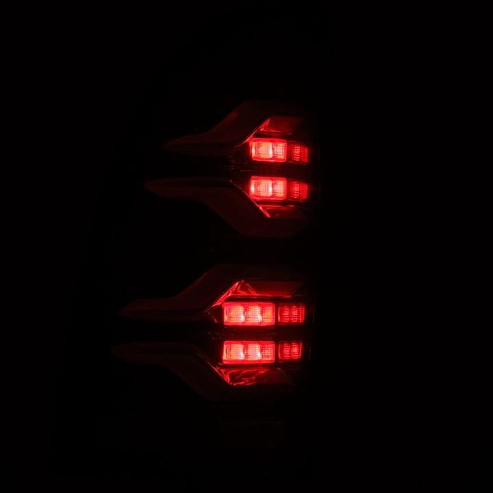 AlphaRex 05-15 Toyota Tacoma LUXX LED Taillights Alpha Blk w/Activ Light/Seq Signal - Bull Strap