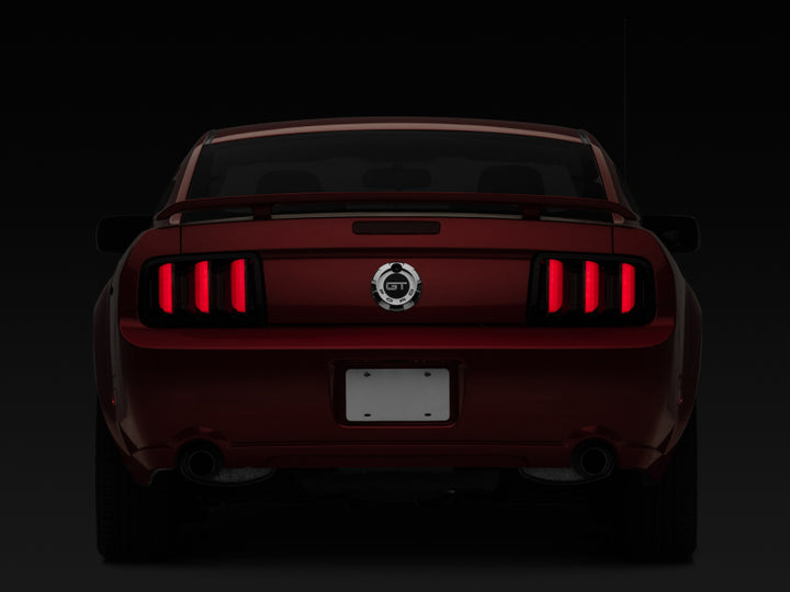 Raxiom 05-09 Ford Mustang Vector V2 LED Tail Lights- Black Housing (Smoked Lens) - Bull Strap