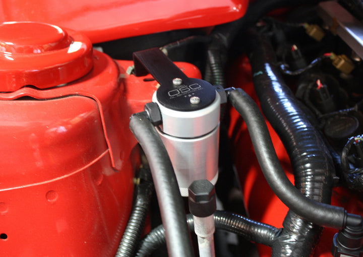 J&L 05-10 Ford Mustang GT/Bullitt/Saleen Passenger Side Oil Separator 3.0 - Clear Anodized - Bull Strap