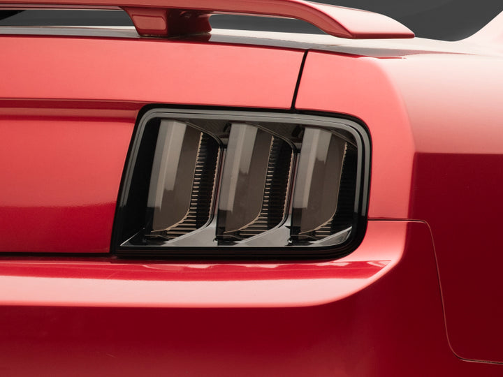 Raxiom 05-09 Ford Mustang Vector V2 LED Tail Lights- Black Housing (Smoked Lens) - Bull Strap