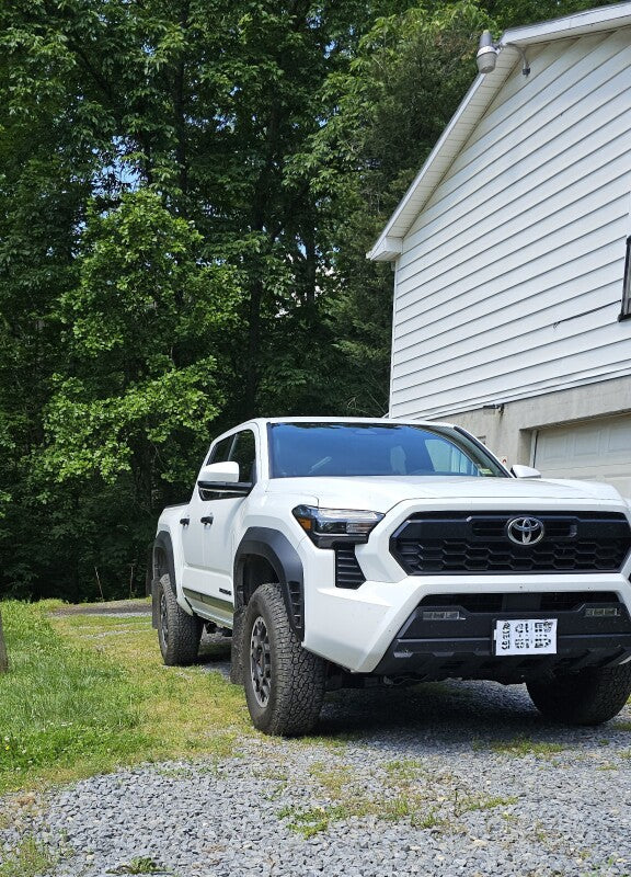 Rally Armor 24-25 Toyota Tacoma Gen 4 Black UR Mud Flap w/White Logo - Bull Strap